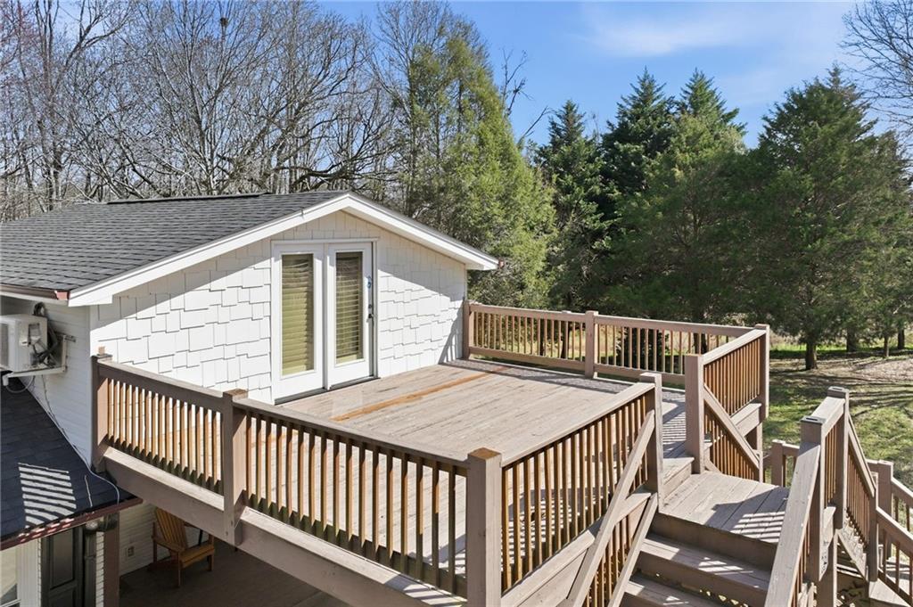 4005 Price Road Gainesville, GA 30506 - Photo 28 of 49 a view of a roof deck with wooden fence and floor