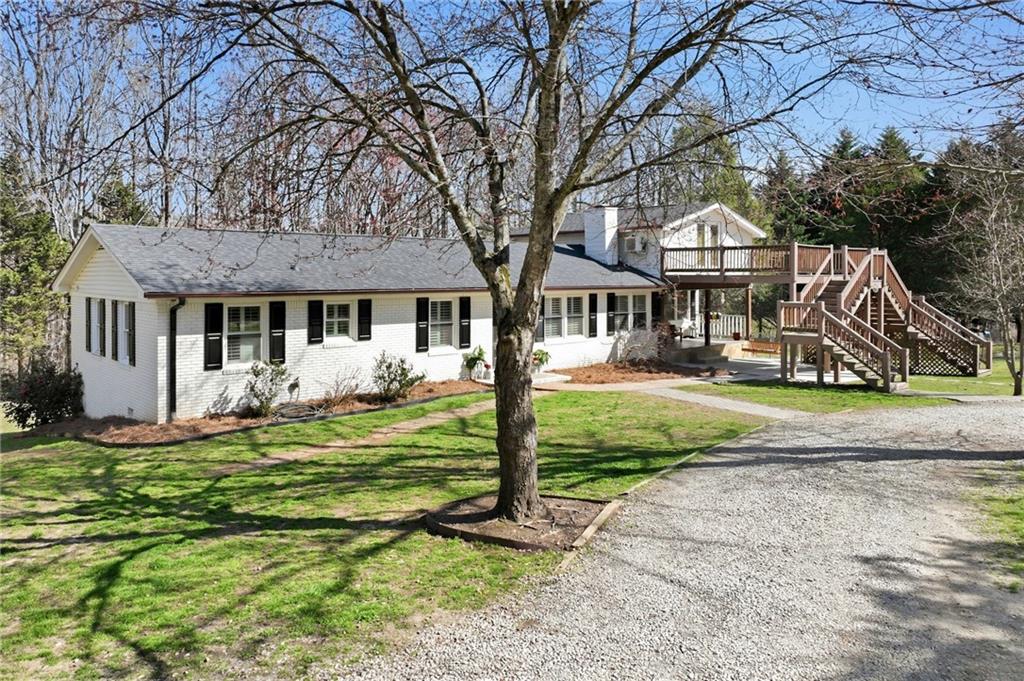 4005 Price Road Gainesville, GA 30506 - Photo 3 of 49 a front view of a house with a yard table and chairs