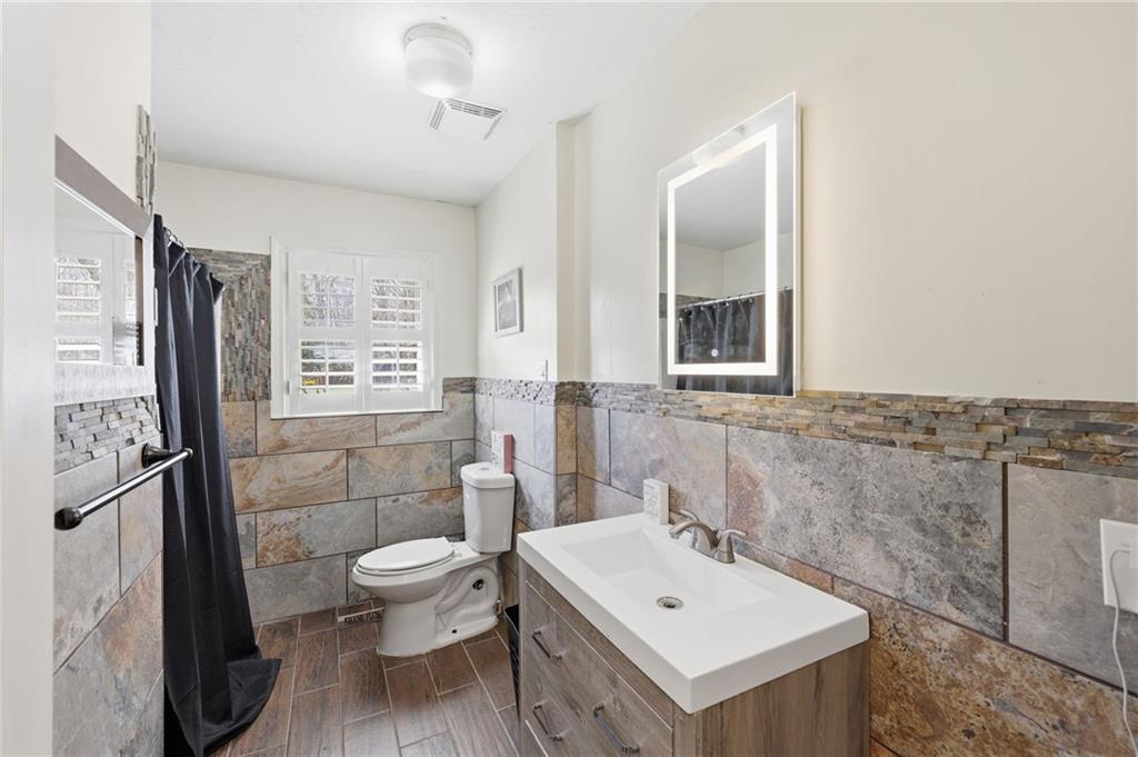 4005 Price Road Gainesville, GA 30506 - Photo 31 of 49 a bathroom with a sink toilet and shower