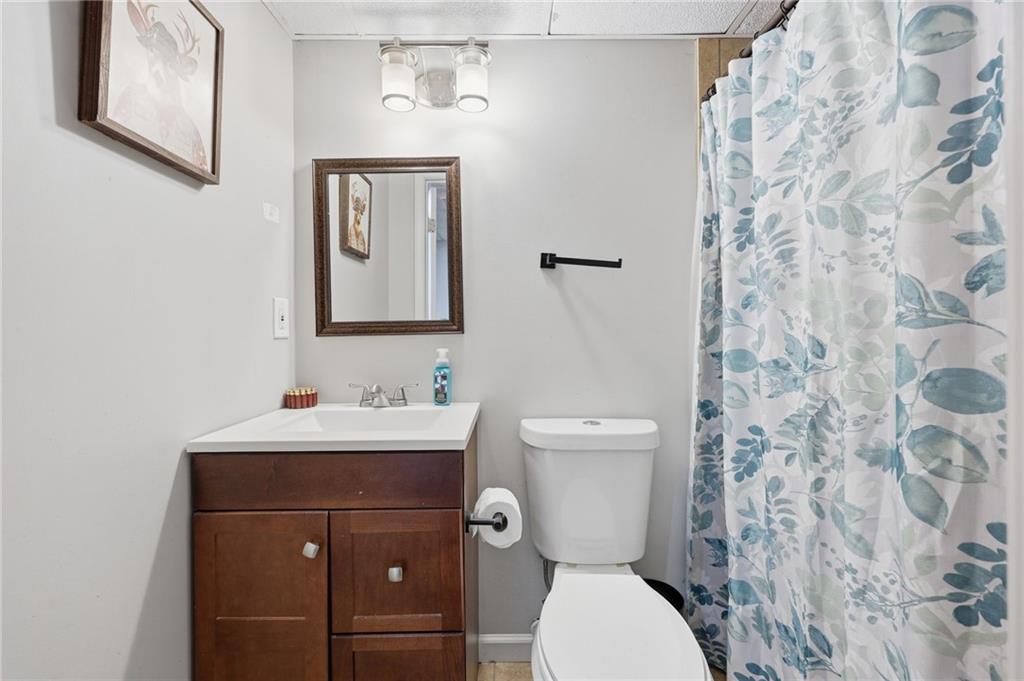 4005 Price Road Gainesville, GA 30506 - Photo 35 of 49 a bathroom with a toilet sink and mirror