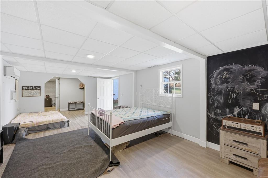 4005 Price Road Gainesville, GA 30506 - Photo 42 of 49 a spacious bedroom with a bed and a dresser