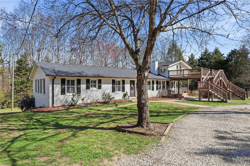 4005 Price Road Gainesville, GA 30506 - Photo 46 of 49 a front view of a house with garden and trees