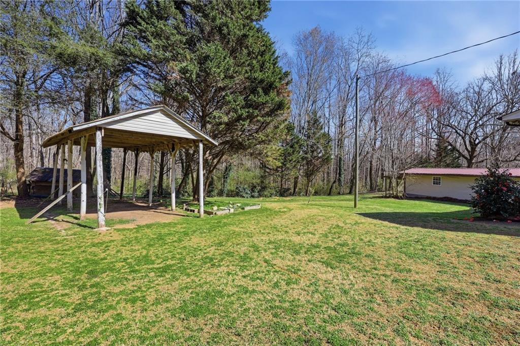 4005 Price Road Gainesville, GA 30506 - Photo 49 of 49 a view of a house with backyard and trees