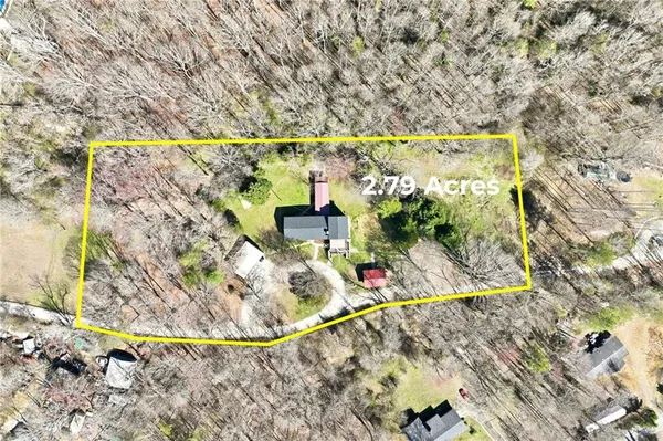 a view of a porch with furniture and floor to ceiling window