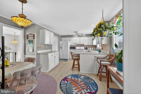 a very nice looking dining room with a table and chairs