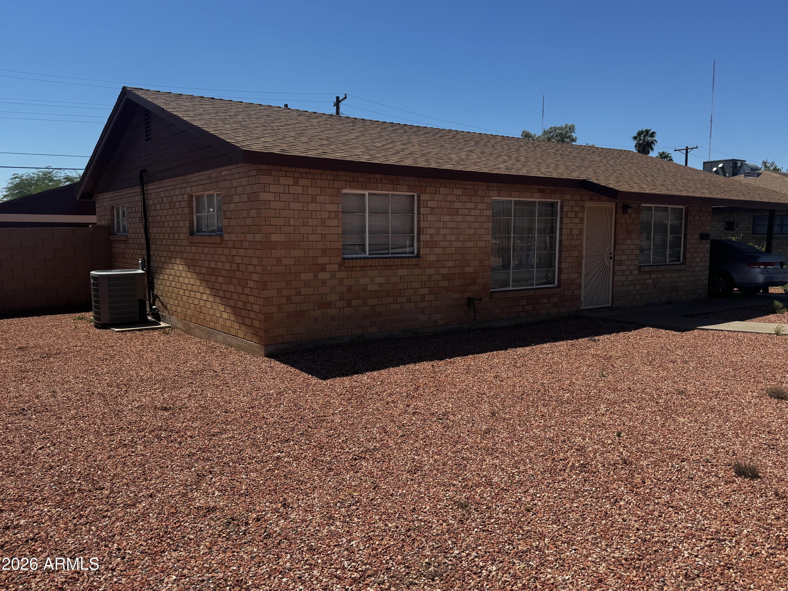 2743 West Ocotillo Road Phoenix, AZ 85017 - Photo 2 of 7 a front view of a house with a yard