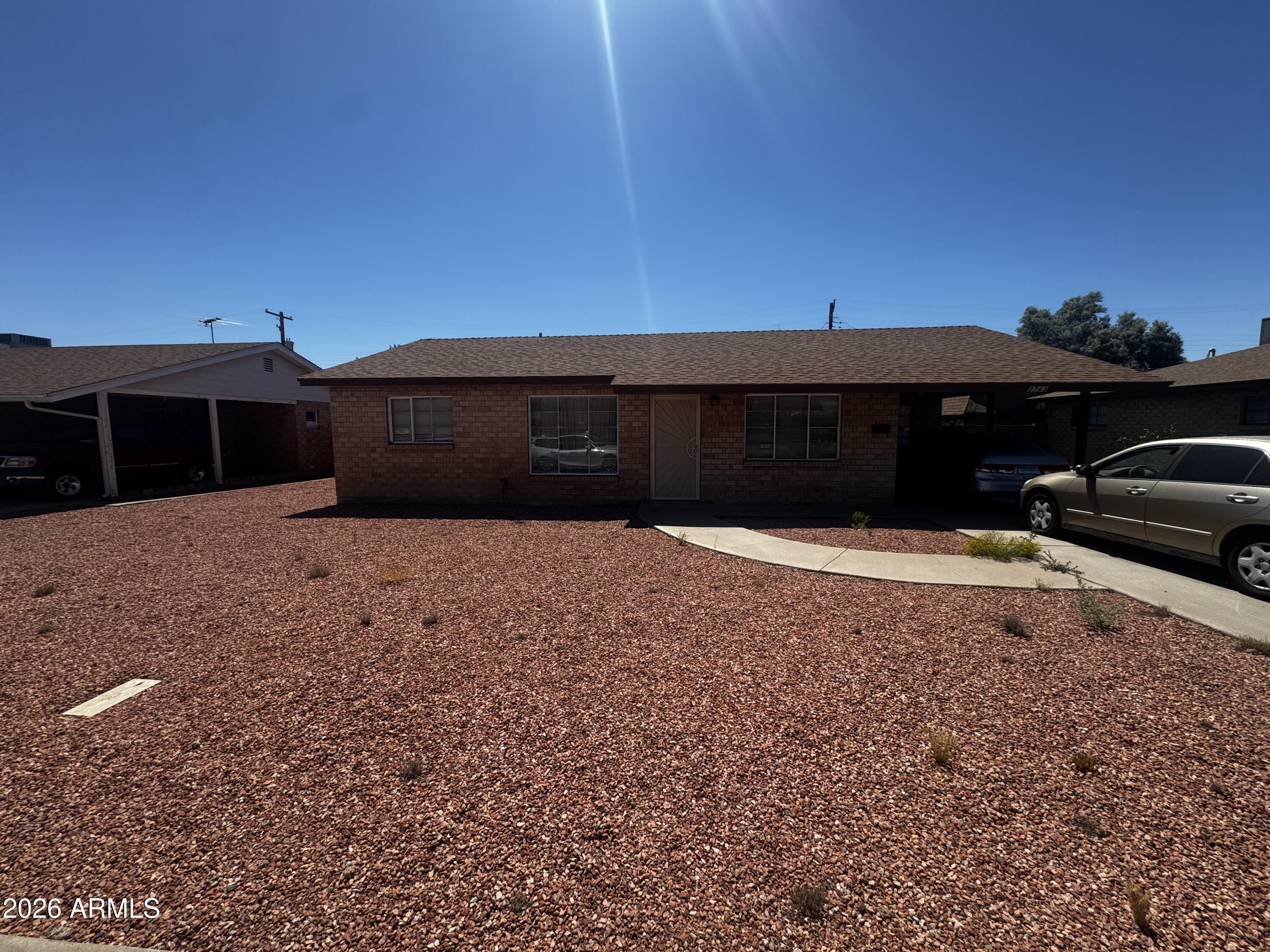 2743 West Ocotillo Road Phoenix, AZ 85017 - Photo 3 of 7 a front view of a house with a yard