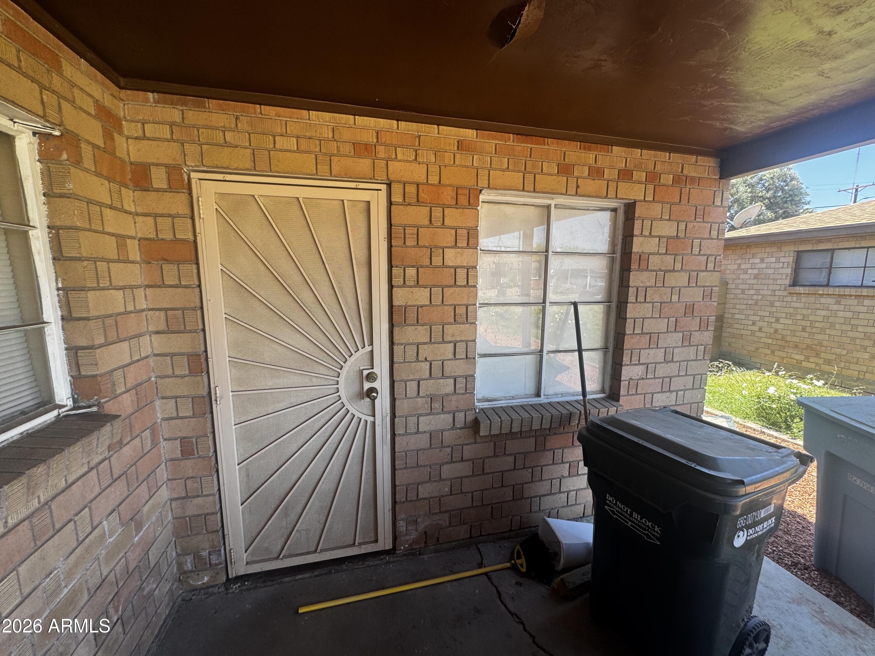 2743 West Ocotillo Road Phoenix, AZ 85017 - Photo 7 of 7 a view of door with outdoor seating