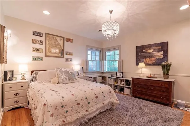 a bedroom with a large bed and a window