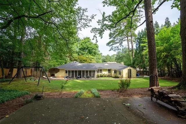 a view of a house with a yard