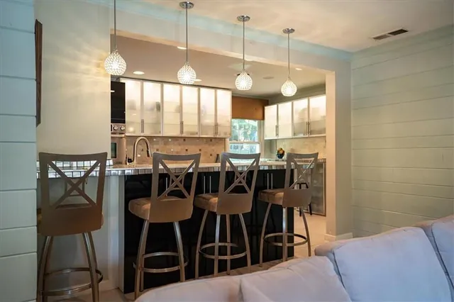 a view of a dining room with furniture and window
