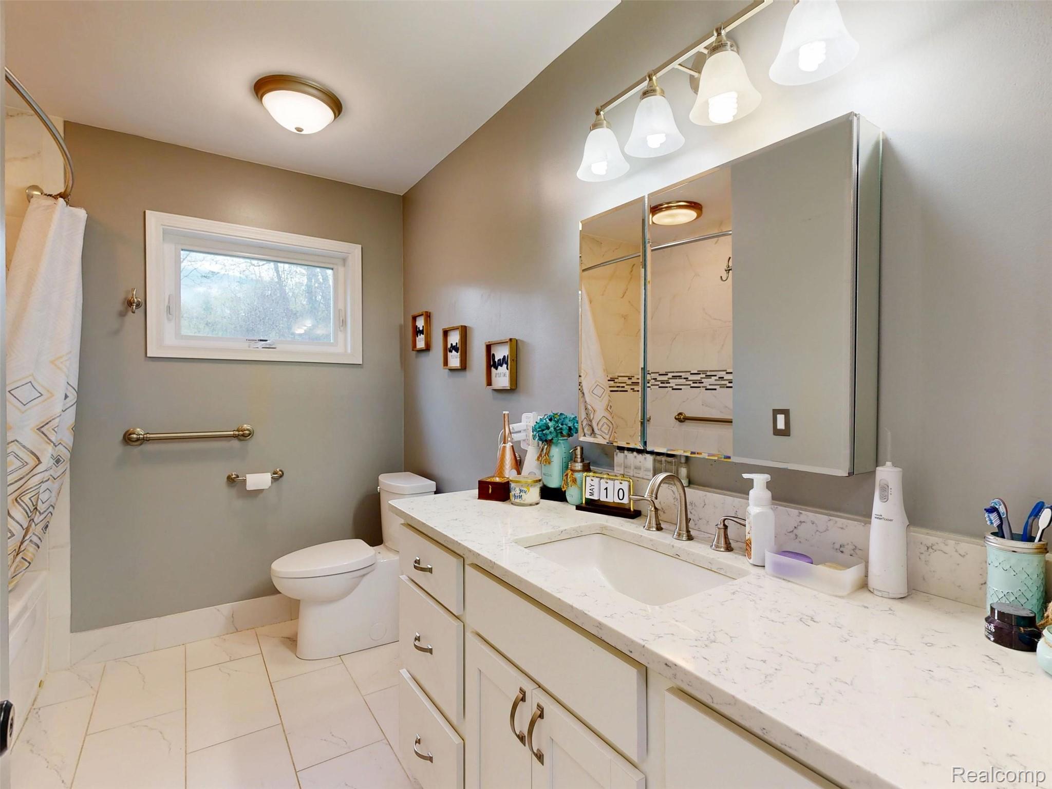 10300 Clark Road Davisburg, MI 48350 - Photo 24 of 39 Bathroom with vanity and shower / bath combo