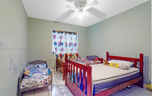 a bedroom with furniture and a chandelier