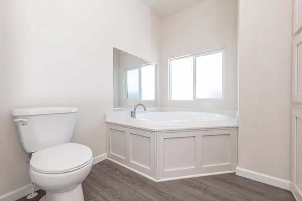 a bathroom with a double vanity sink and mirror