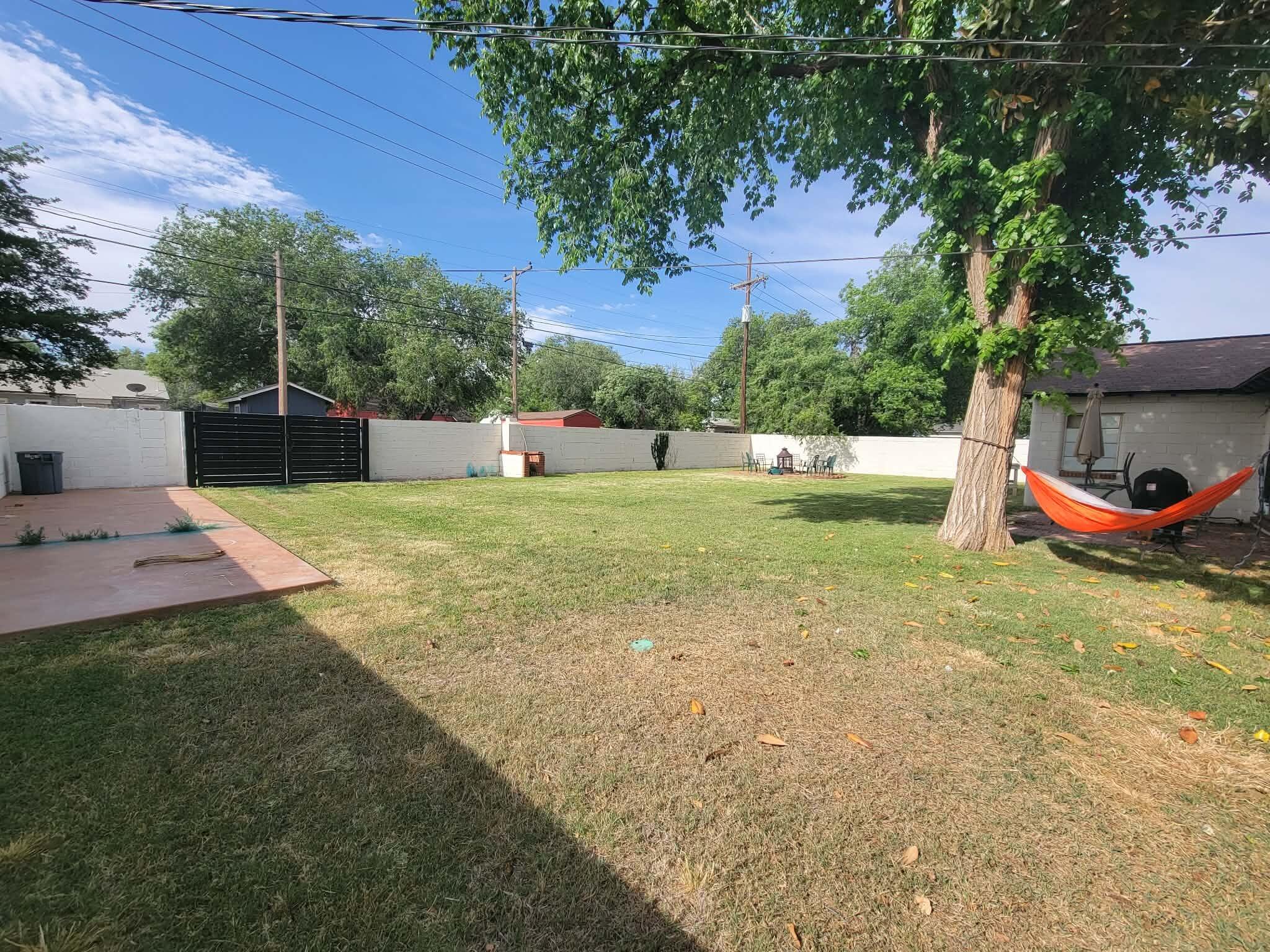 3105 29th Street Lubbock, TX 79410 - Photo 18 of 18 a view of a swimming pool with a yard