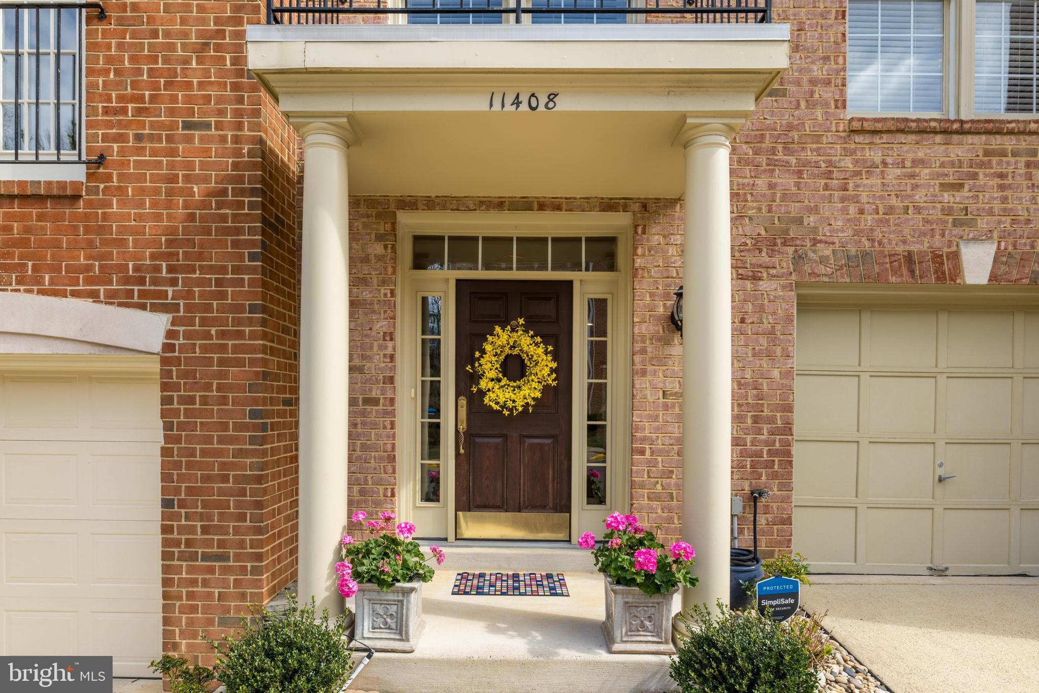 11408 Summer House Court Reston, VA 20194 - Photo 2 of 35 a front view of a house with flowers