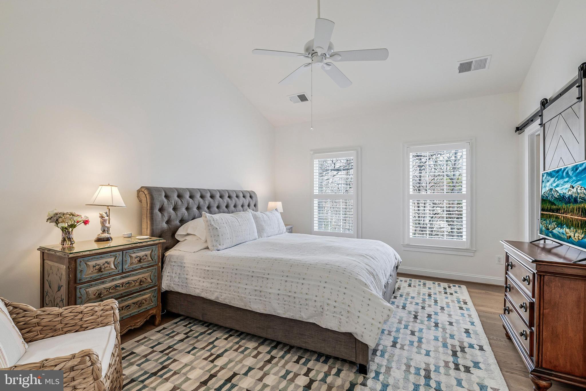 11408 Summer House Court Reston, VA 20194 - Photo 21 of 35 a bedroom with a bed and a window