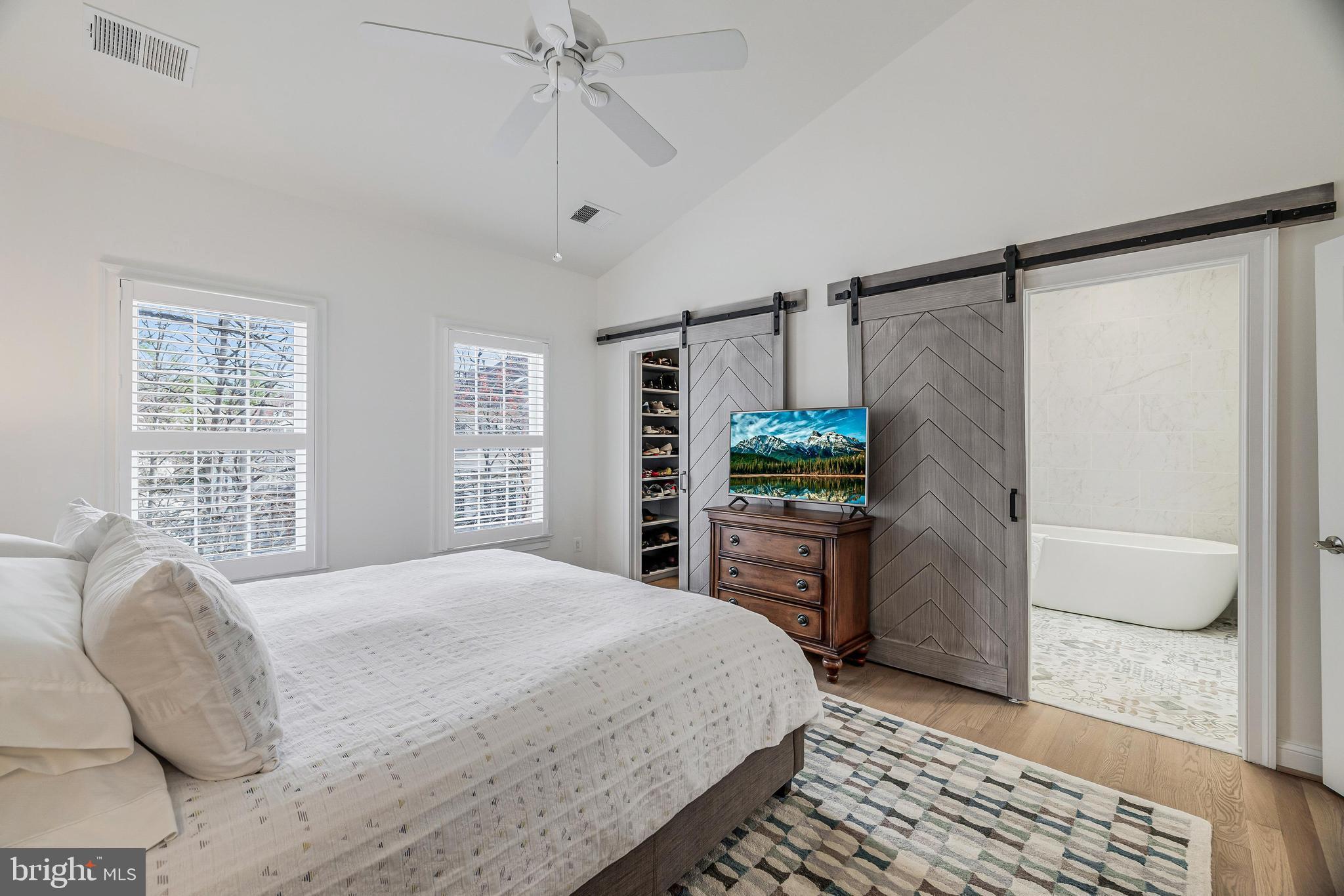 11408 Summer House Court Reston, VA 20194 - Photo 22 of 35 a bedroom with a bed and a dresser