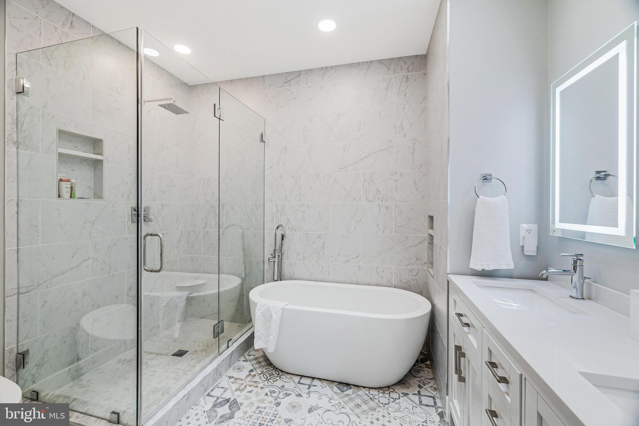 11408 Summer House Court Reston, VA 20194 - Photo 23 of 35 a bathroom with a granite countertop sink a toilet and shower