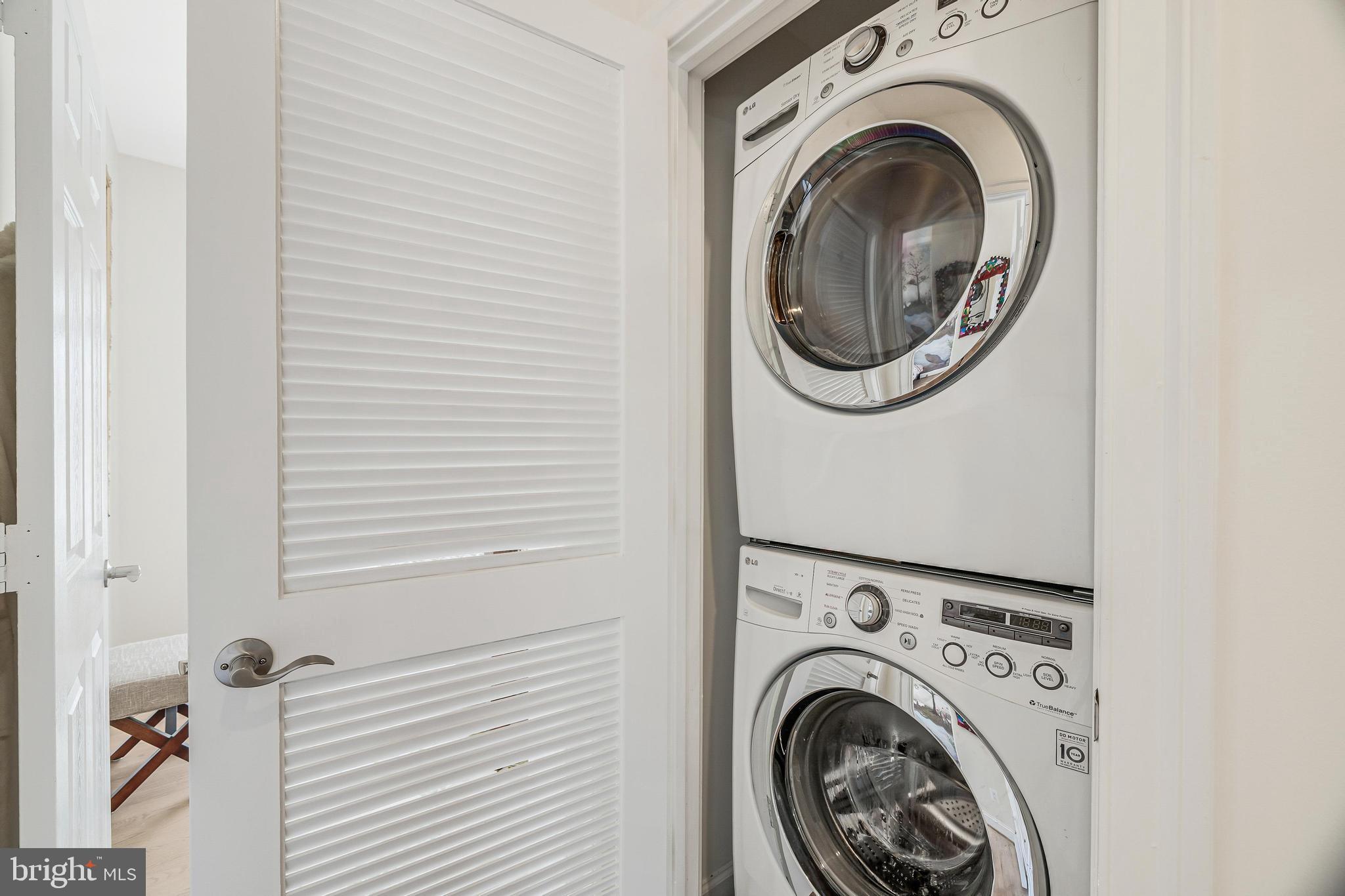 11408 Summer House Court Reston, VA 20194 - Photo 28 of 35 a view of a hallway with washer and dryer