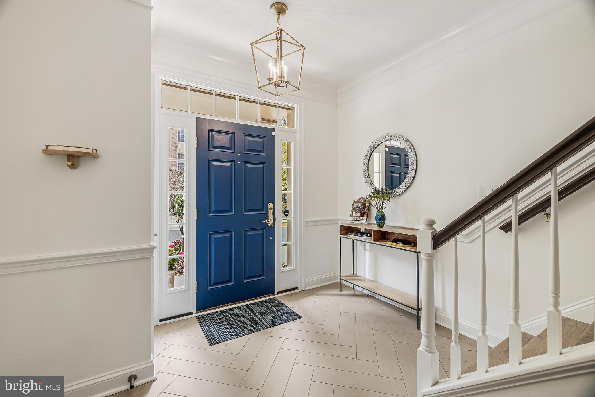 11408 Summer House Court Reston, VA 20194 - Photo 3 of 35 a view of a hallway with entryway wooden floor and front door