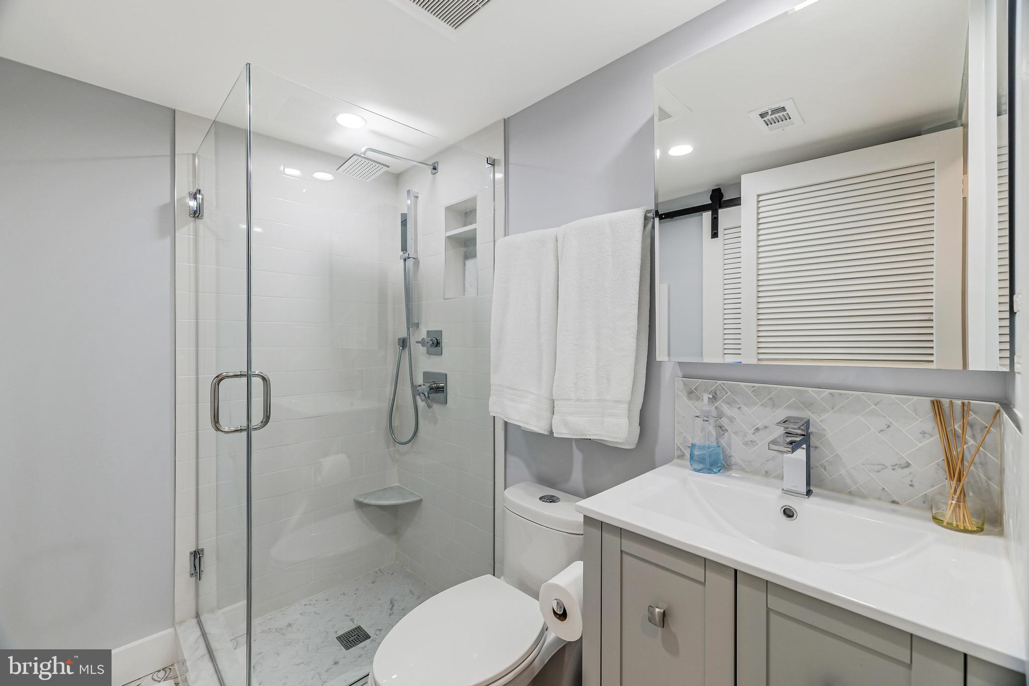 11408 Summer House Court Reston, VA 20194 - Photo 32 of 35 a bathroom with a sink toilet and shower