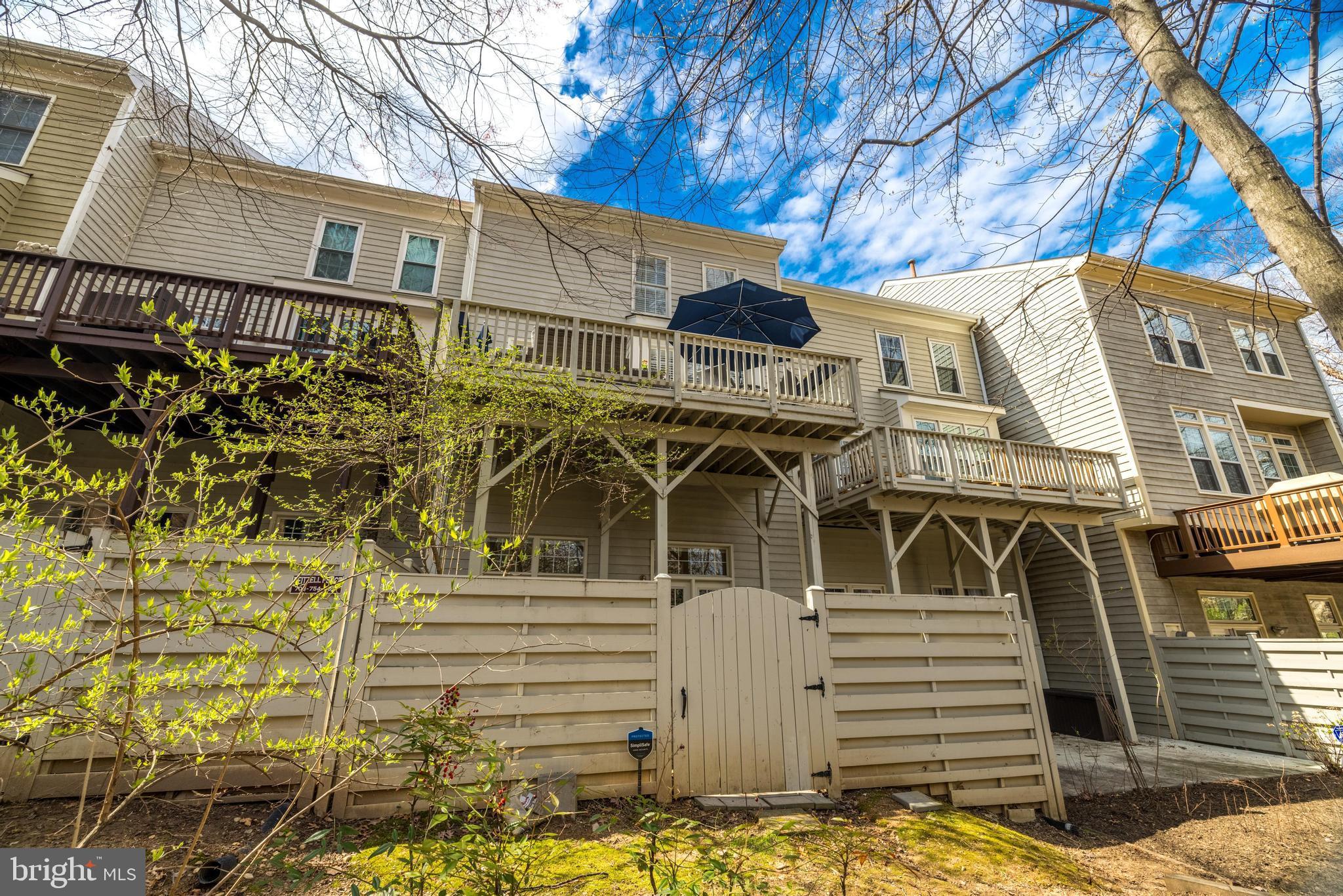 11408 Summer House Court Reston, VA 20194 - Photo 35 of 35 a front view of a house with a yard