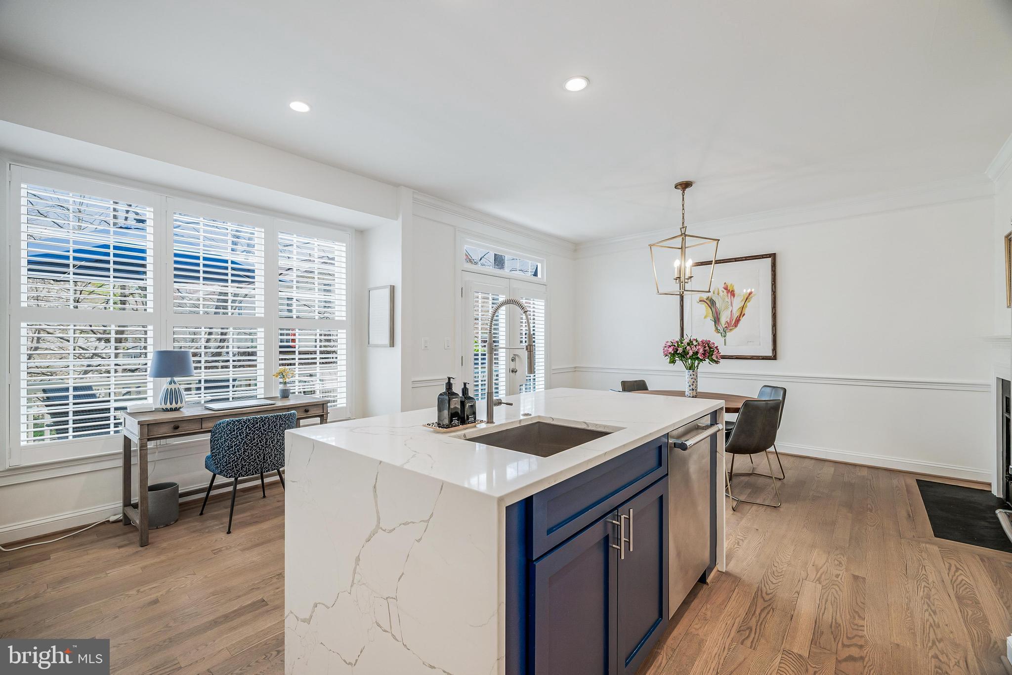 11408 Summer House Court Reston, VA 20194 - Photo 8 of 35 a kitchen with a stove a sink and wooden floor