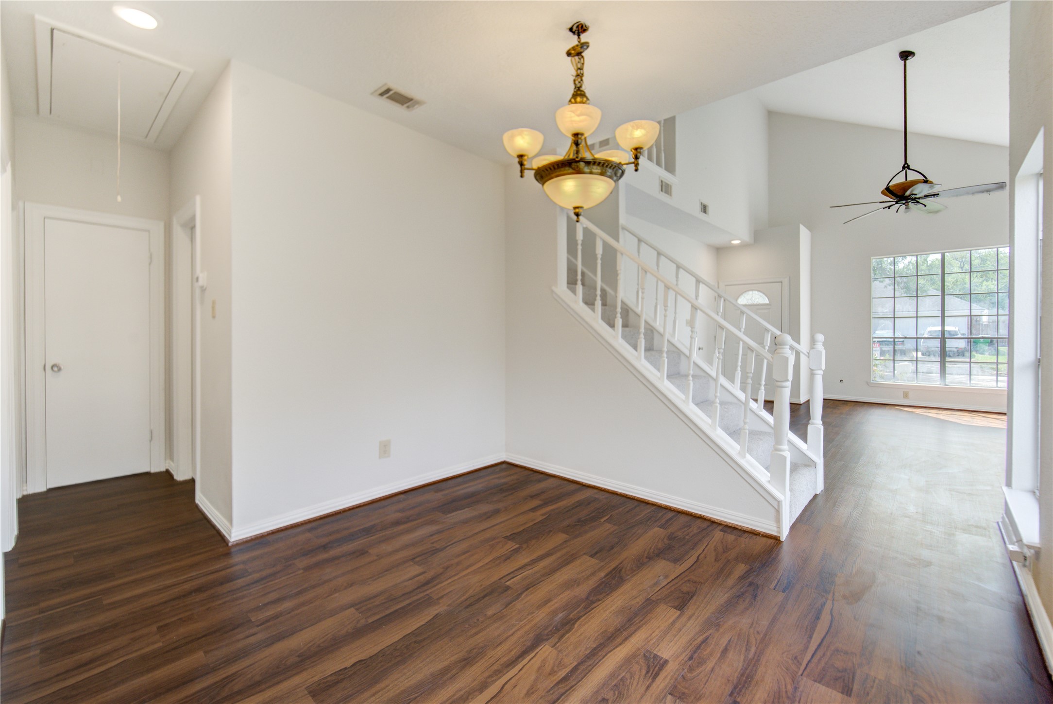 308 North Ranch House Road Angleton, TX 77515 - Photo 11 of 38 Dedicated dining area with elegant chandelier and open flow into the main living space. The layout is perfect for entertaining, with easy access to both the kitchen and living areas.