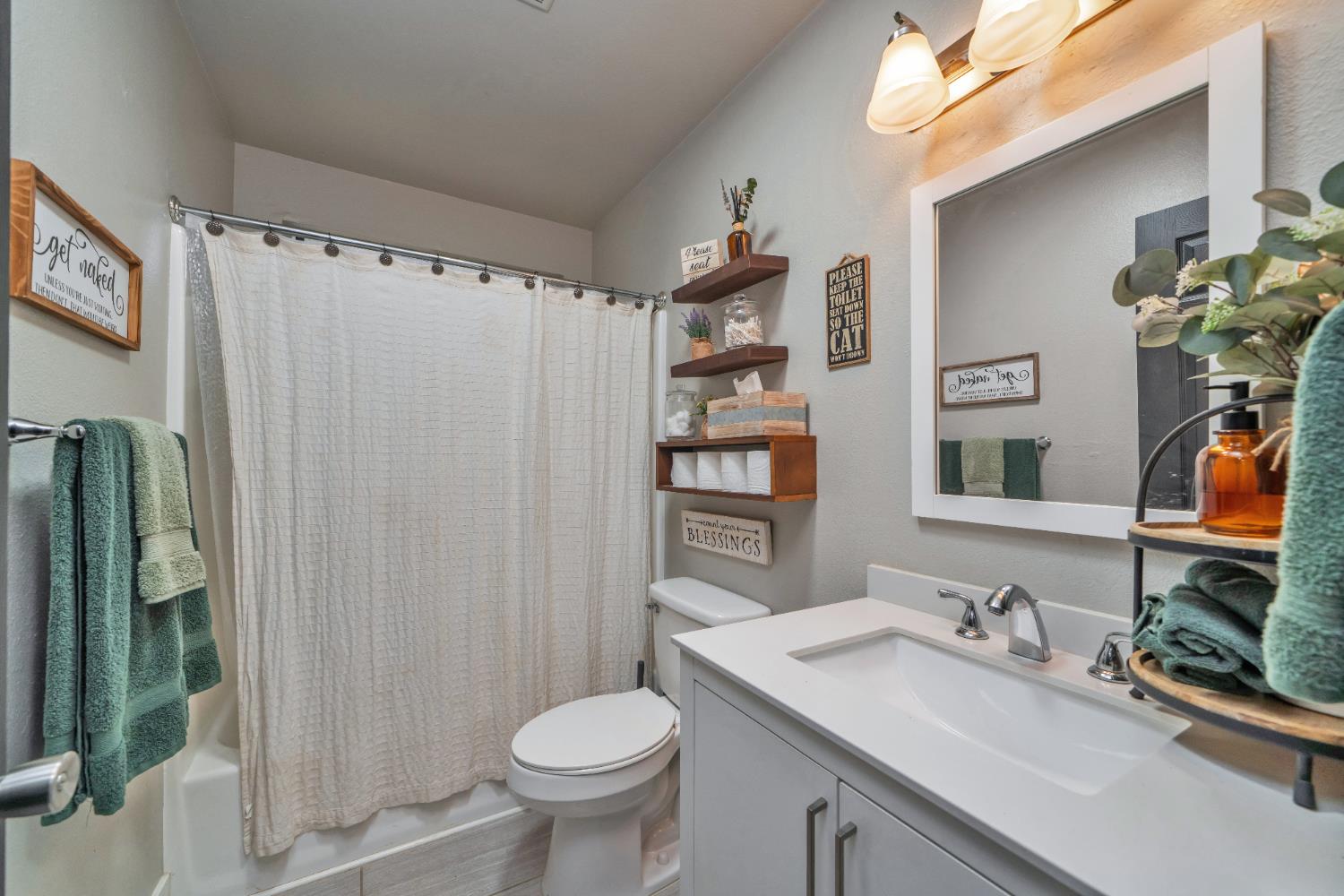 5781 Sly Park Road Pollock Pines, CA 95726 - Photo 39 of 42 Full bathroom featuring vanity and shower / tub combo with curtain newly updated