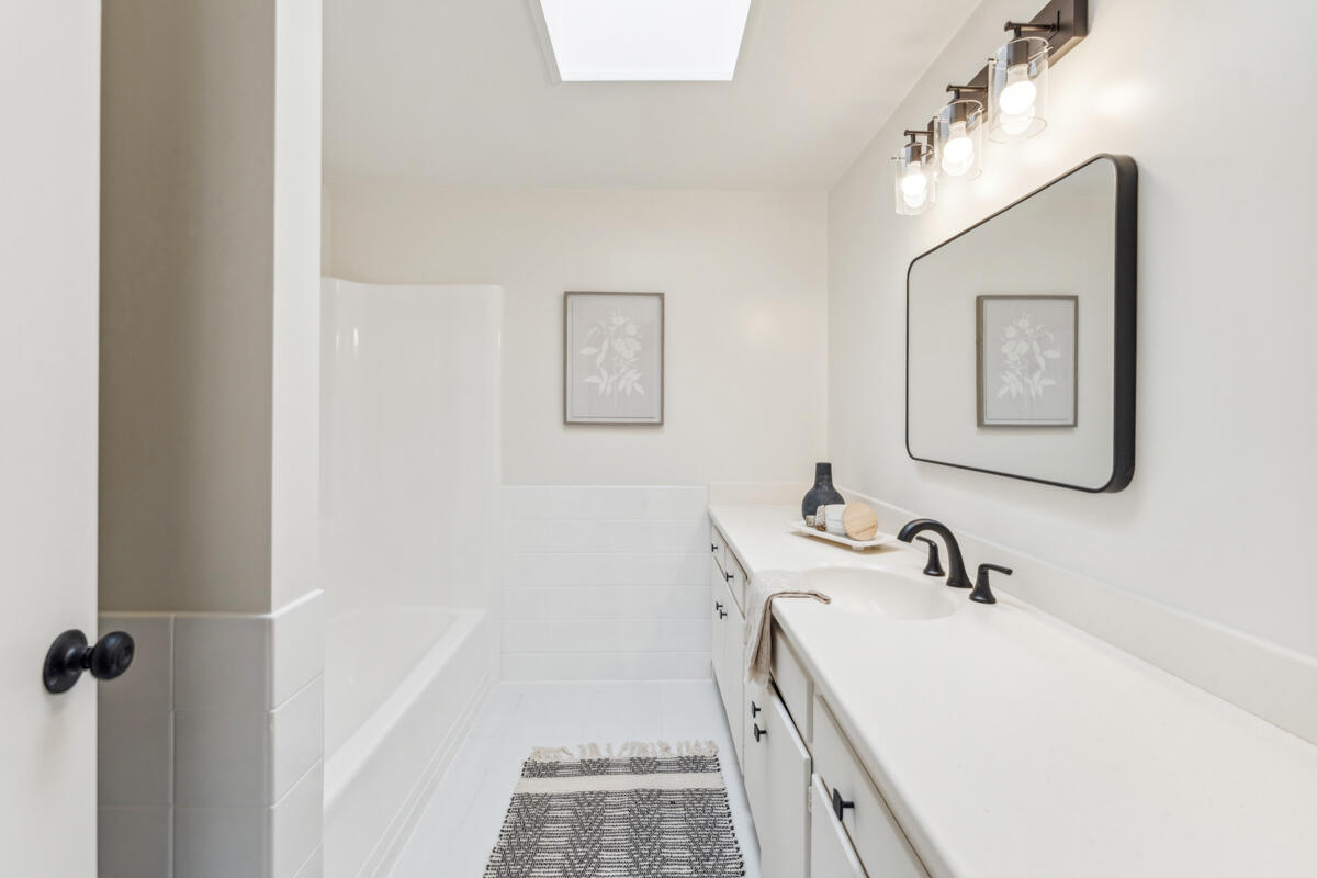 7286 Georgetown Road Goleta, CA 93117 - Photo 11 of 19 a bathroom with a sink and mirror