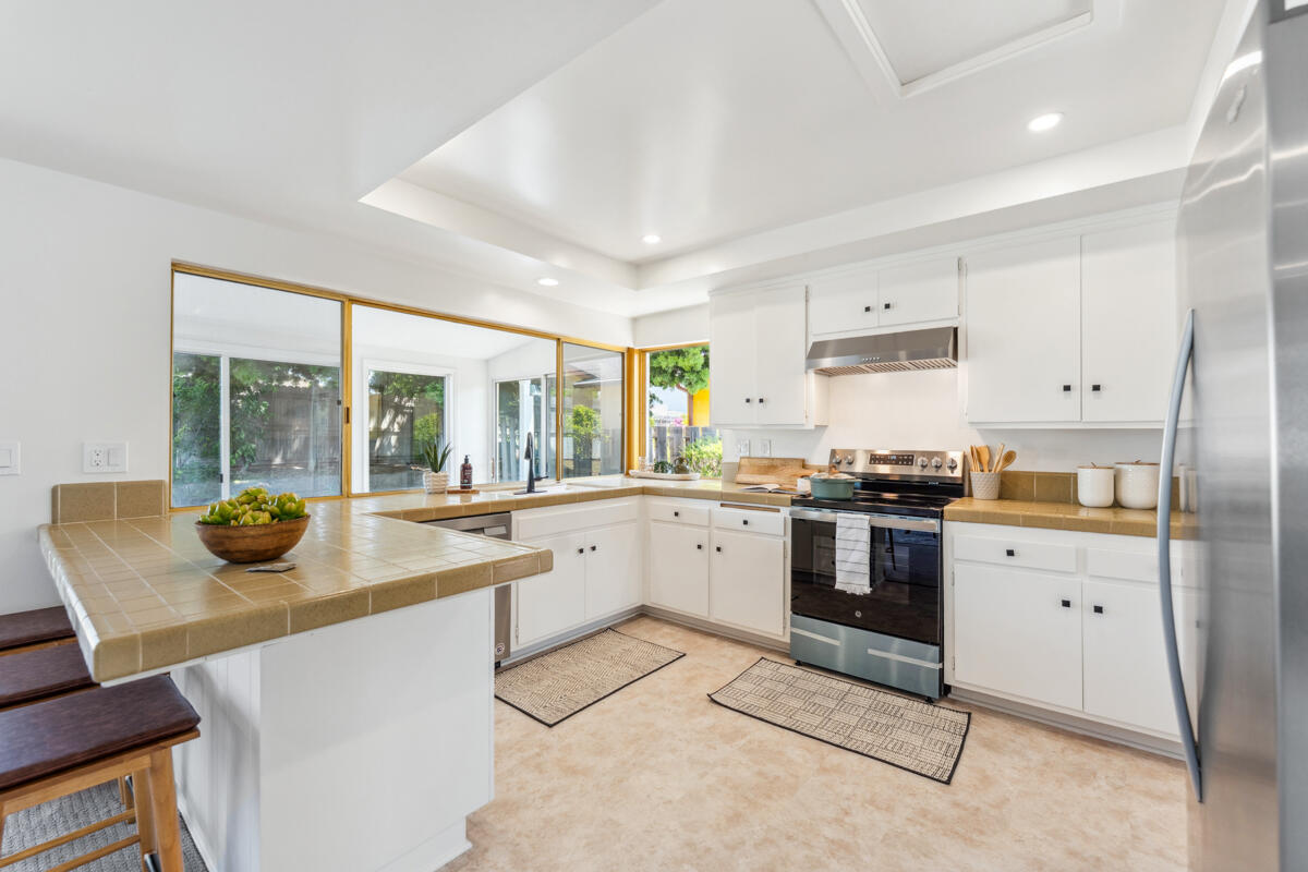 7286 Georgetown Road Goleta, CA 93117 - Photo 3 of 19 a kitchen with a sink and white cabinets