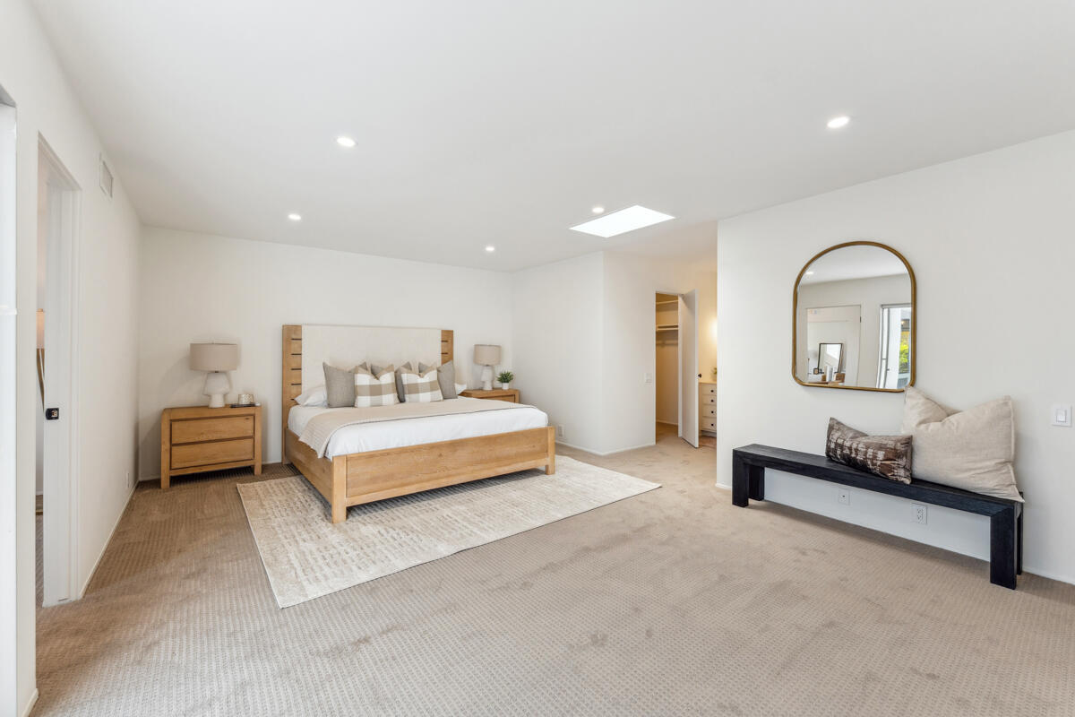 7286 Georgetown Road Goleta, CA 93117 - Photo 4 of 19 a spacious bedroom with a bed and a couch