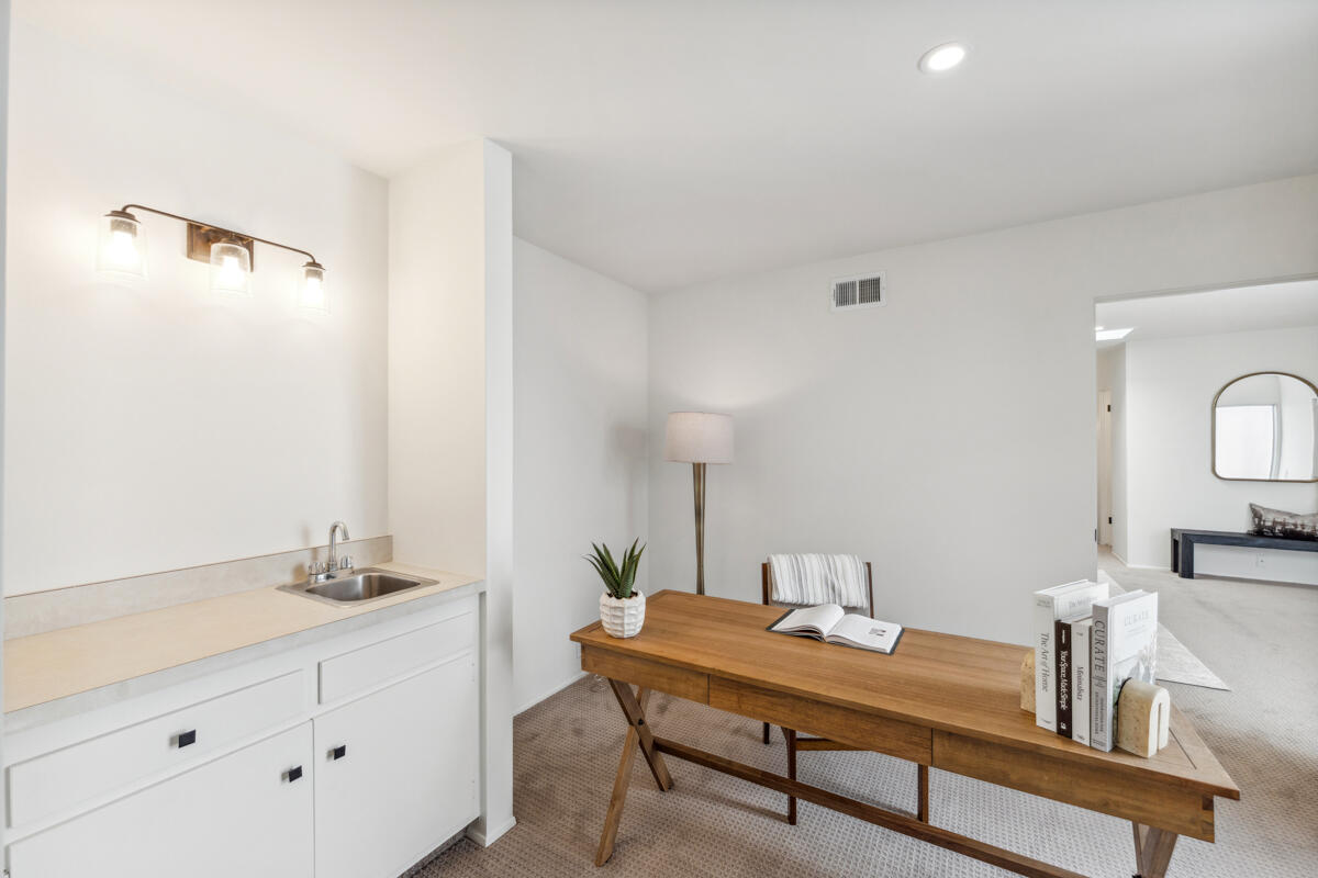 7286 Georgetown Road Goleta, CA 93117 - Photo 6 of 19 a room with a table chairs and a wooden floor