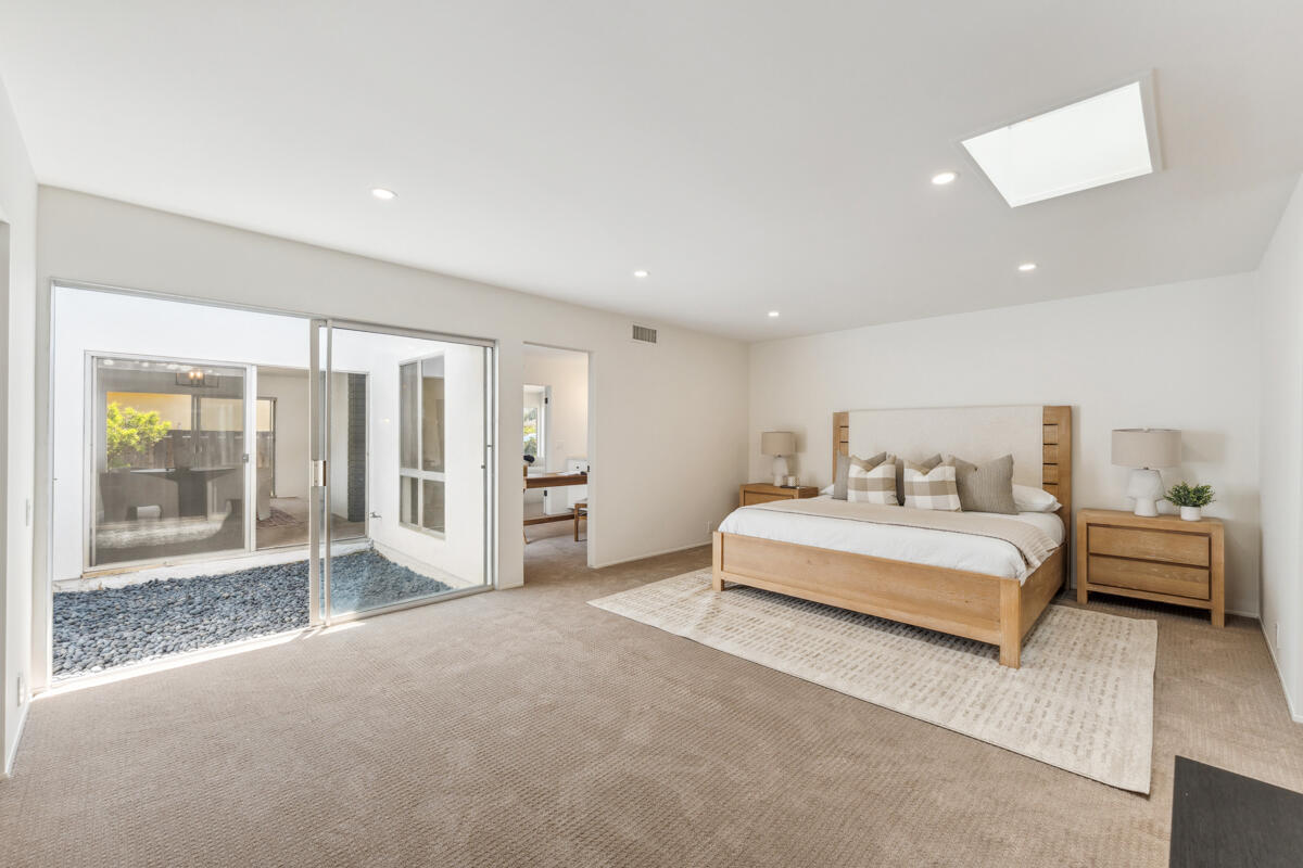 7286 Georgetown Road Goleta, CA 93117 - Photo 9 of 19 a spacious bedroom with a bed and a large window