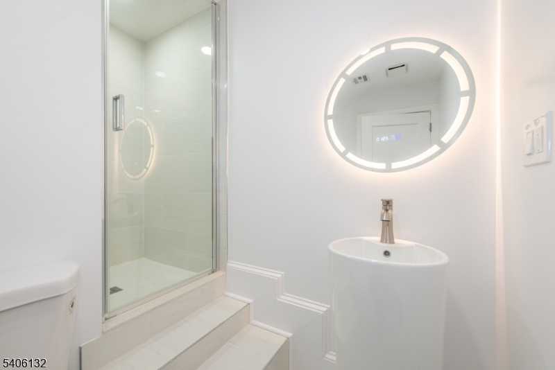 570 Cameron Road South Orange, NJ 07079 - Photo 16 of 34 a bathroom with a sink and mirror