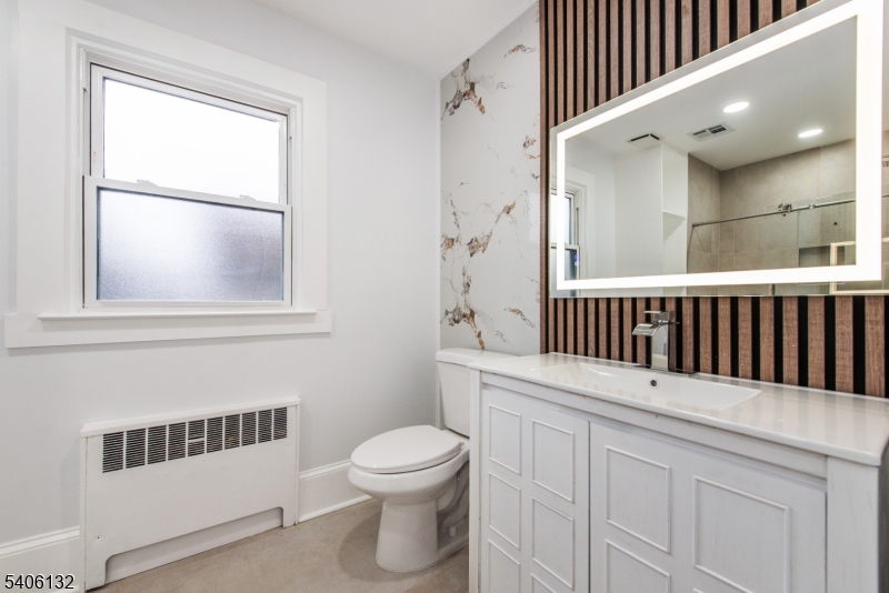 570 Cameron Road South Orange, NJ 07079 - Photo 24 of 34 a bathroom with a sink a toilet and a window