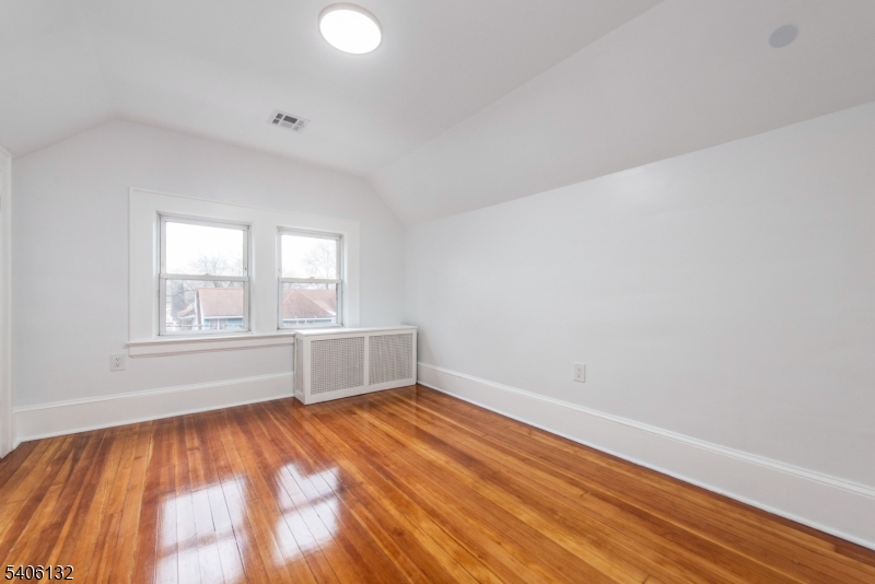 570 Cameron Road South Orange, NJ 07079 - Photo 25 of 34 an empty room with wooden floor and windows
