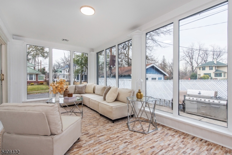 570 Cameron Road South Orange, NJ 07079 - Photo 28 of 34 a living room with furniture and a floor to ceiling window