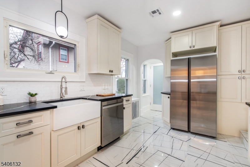 570 Cameron Road South Orange, NJ 07079 - Photo 5 of 34 a kitchen with stainless steel appliances granite countertop a stove a refrigerator and a sink