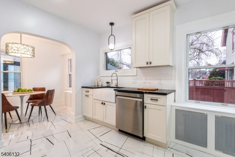 570 Cameron Road South Orange, NJ 07079 - Photo 6 of 34 a kitchen with cabinets appliances and a window