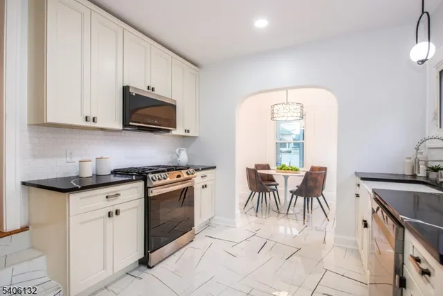 a view of a chairs and table in backyard
