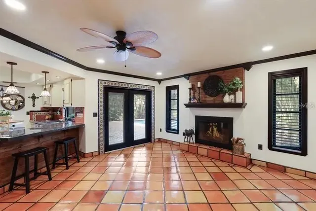 a living room with furniture and a fireplace