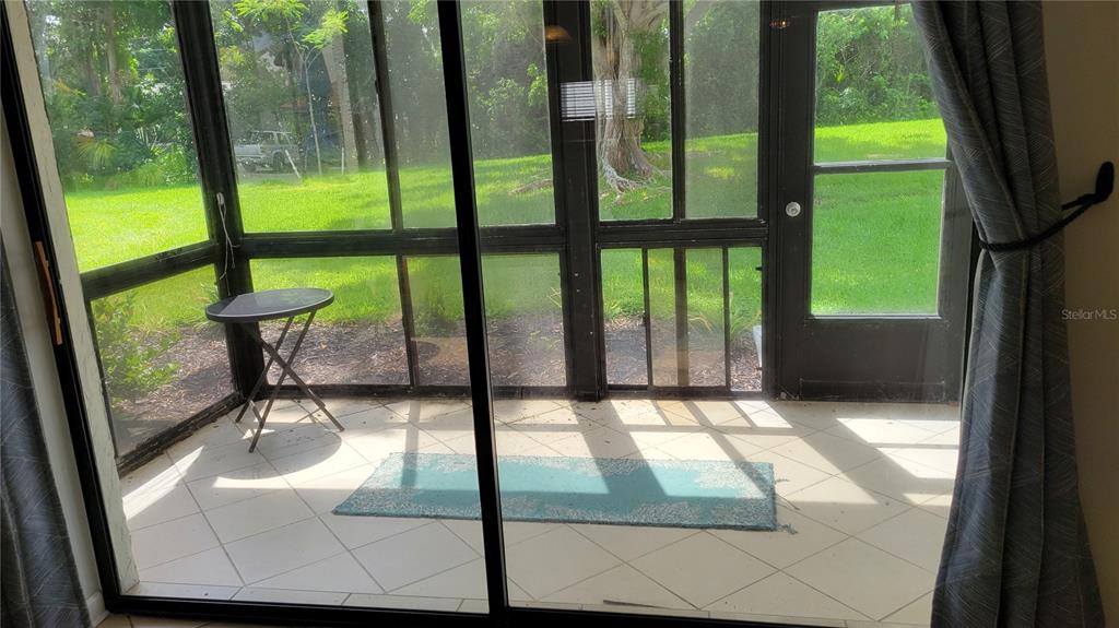 1626 Stickney Point Road, Unit 102 Sarasota, FL 34231 - Photo 11 of 42 a view of swimming pool from a window