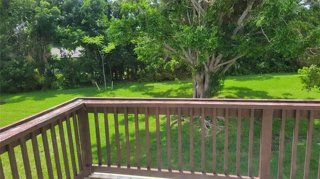 a view of a balcony with a pot