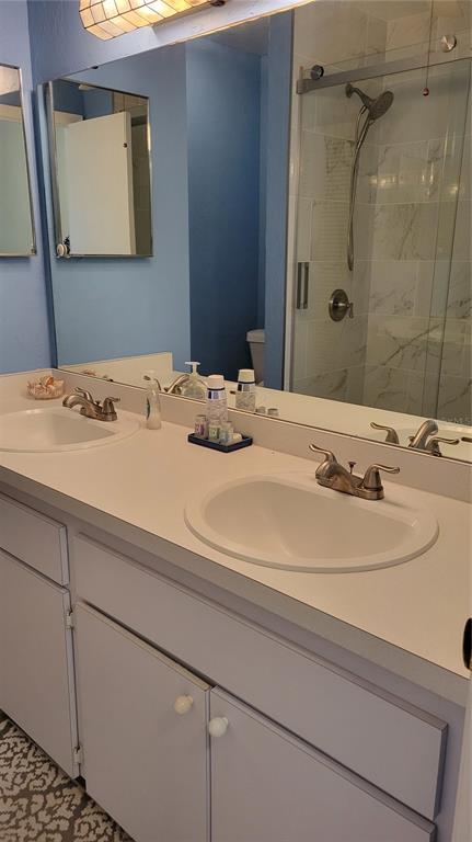 1626 Stickney Point Road, Unit 102 Sarasota, FL 34231 - Photo 19 of 42 a bathroom with a sink and a mirror