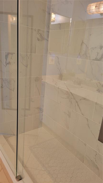 1626 Stickney Point Road, Unit 102 Sarasota, FL 34231 - Photo 20 of 42 a bathroom with a shower