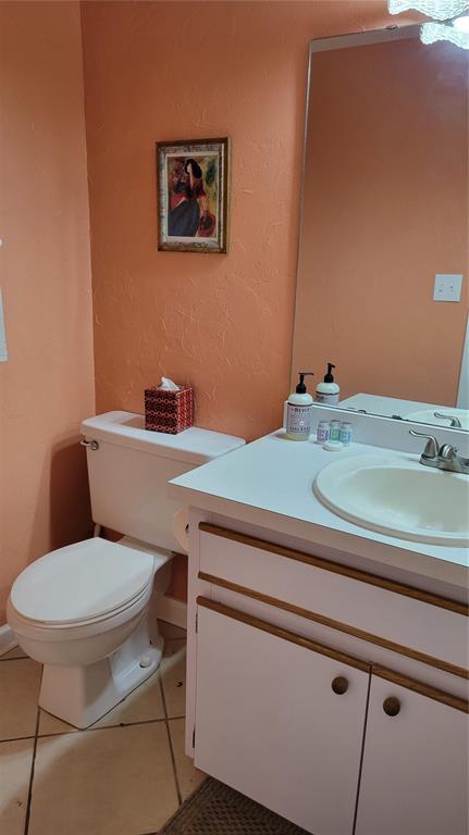 1626 Stickney Point Road, Unit 102 Sarasota, FL 34231 - Photo 22 of 42 a bathroom with a toilet and a sink