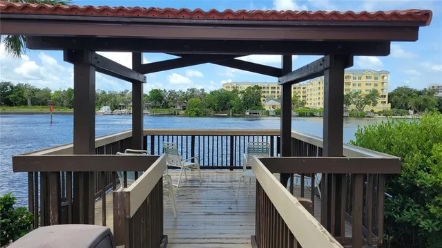 a view of balcony with furniture and garden