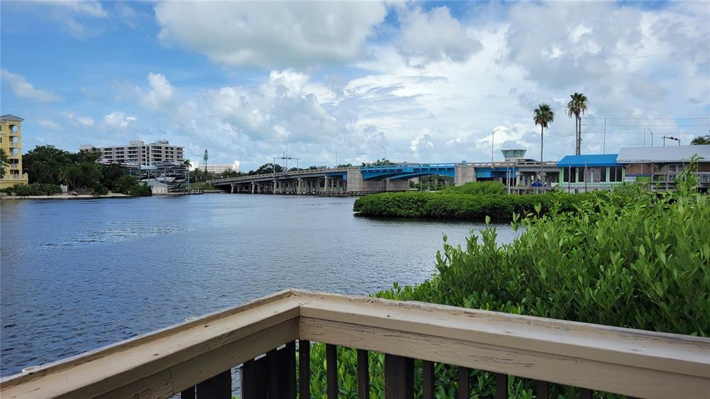 1626 Stickney Point Road, Unit 102 Sarasota, FL 34231 - Photo 30 of 42 a view of a lake from a balcony